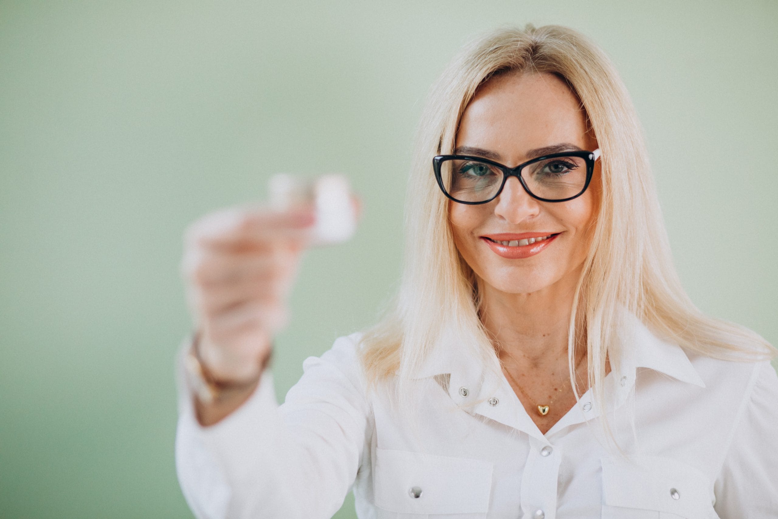 adult woman using anti aging cream scaled